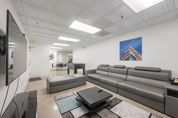 Living room with couch at Grand Central Market Apartments, Los Angeles, California